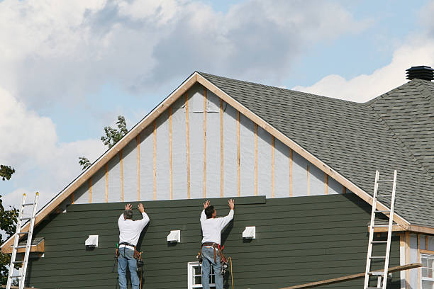 Professional Siding Contractor technician working in Malverne, NY